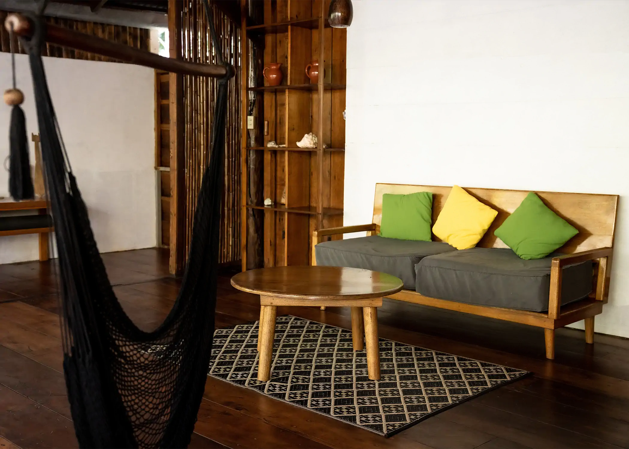 Cozy living room with hammock at Cacao Farm House La Loma