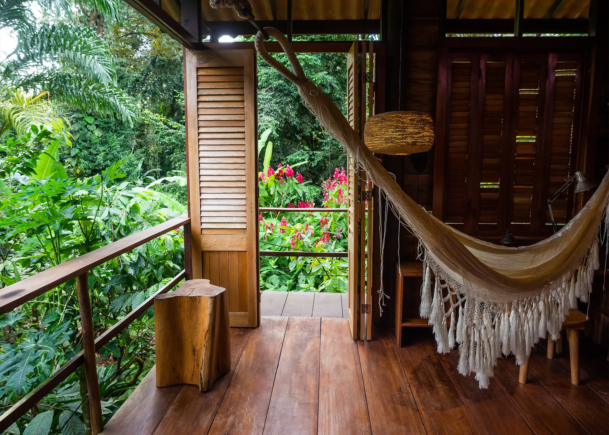 Hammock and wooden terrace at Cacao Farm House jungle bungalow