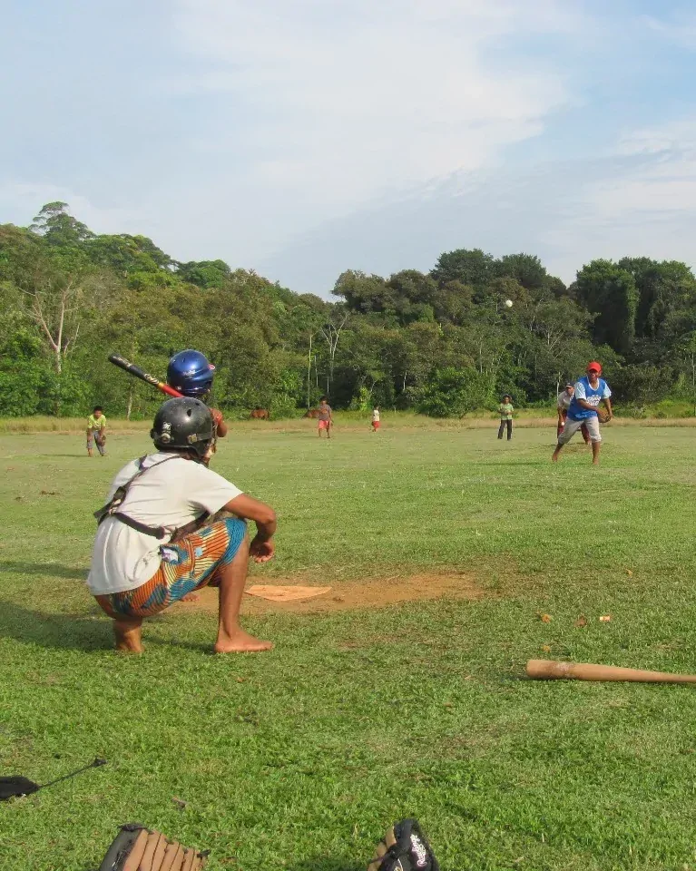 Ngäbe-Buglé children playing baseball game in Bahia Honda community Panama