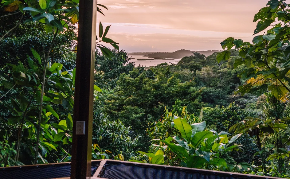 Panoramic sunset views from rainforest bungalow over Bahia Honda Bay