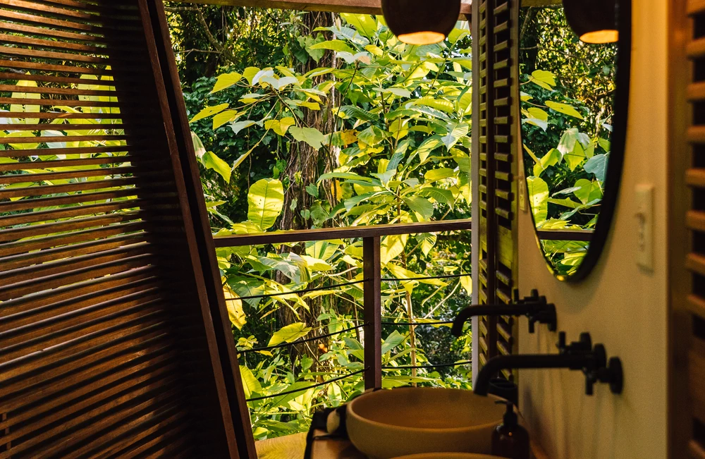 Rainforest Queen Bungalow private bathroom vanity with jungle garden views