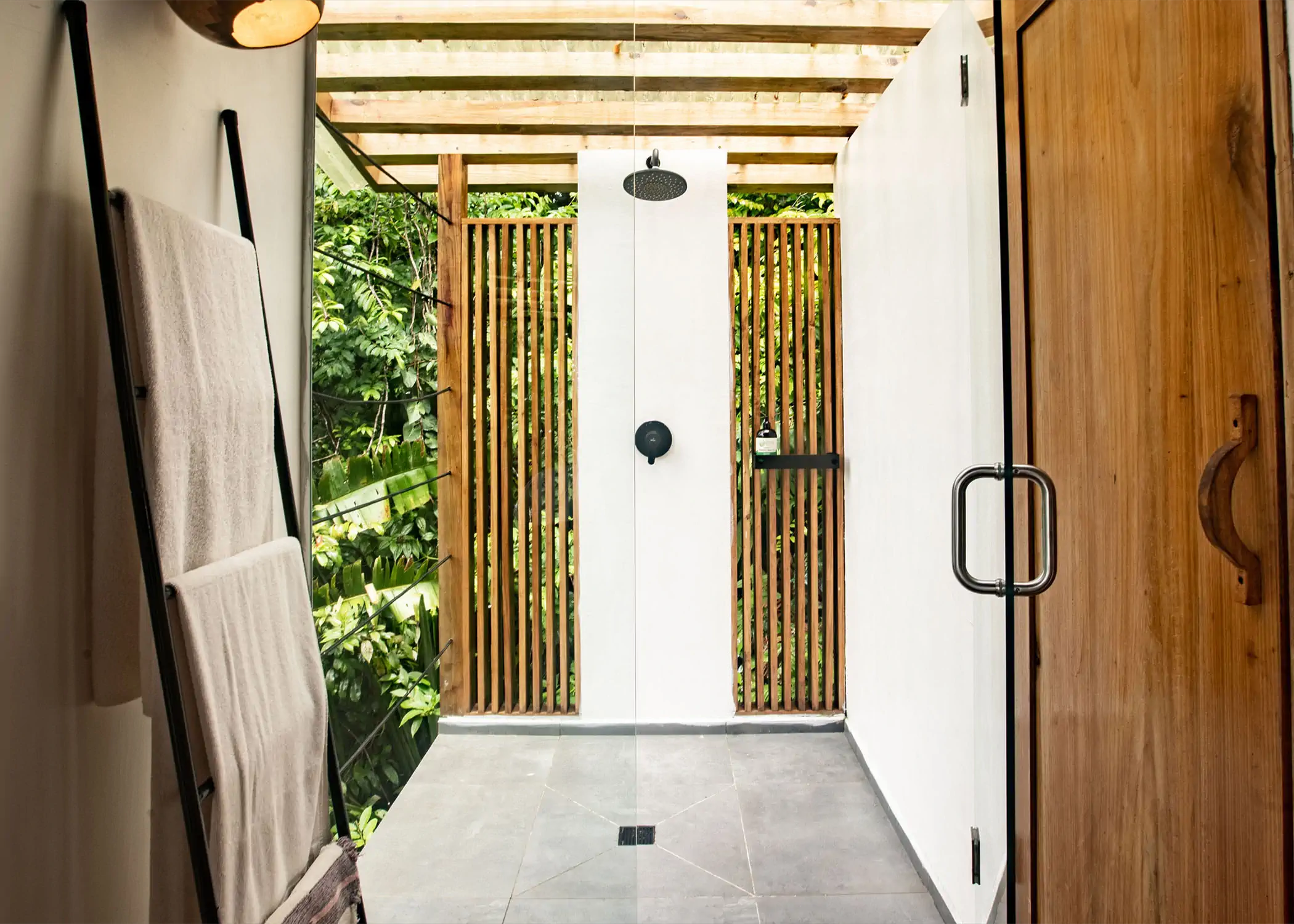 Rainforest Queen Bungalow open-air shower with tropical garden privacy screen