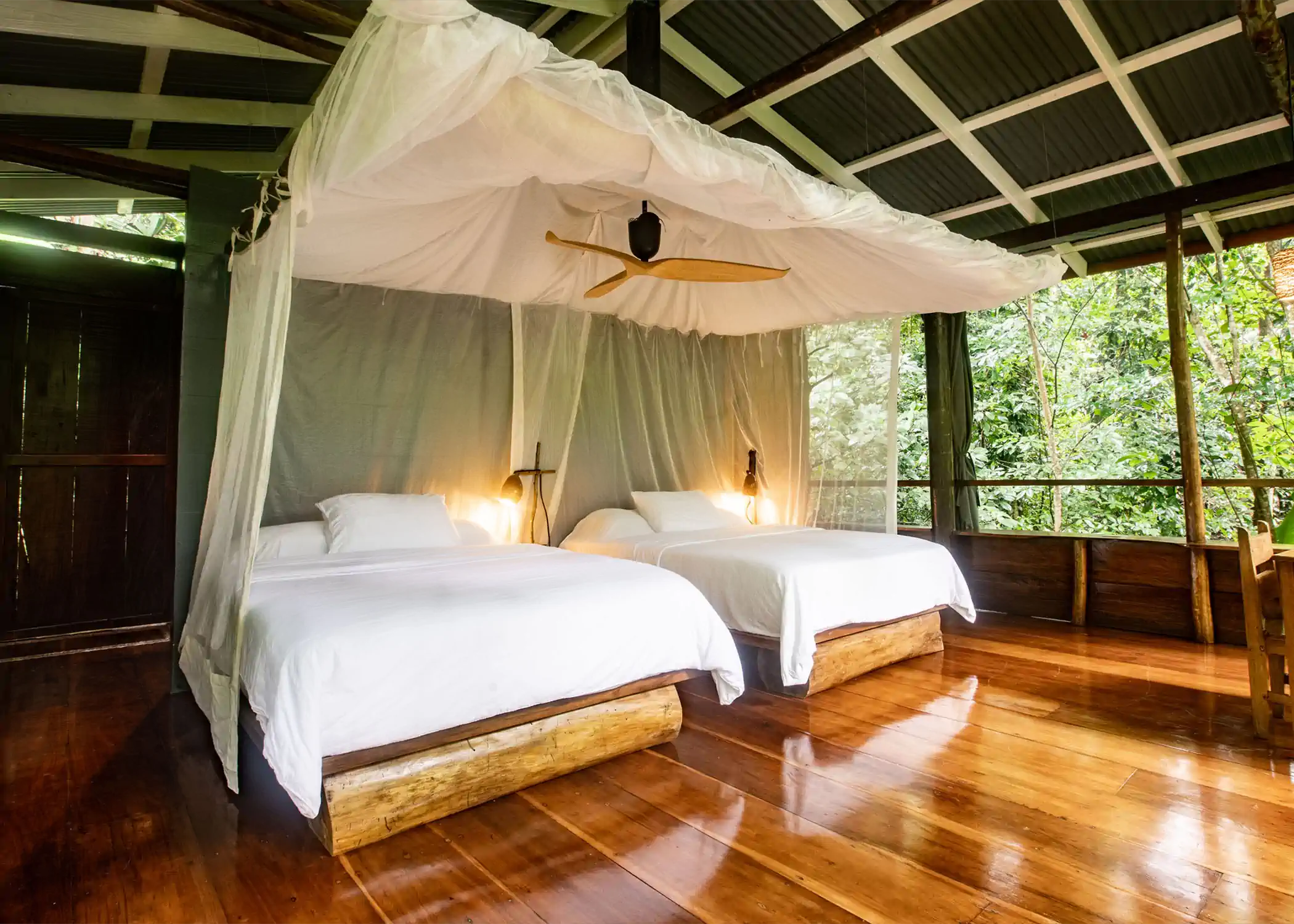 Rock Pool jungle bungalow with twin beds and mosquito netting